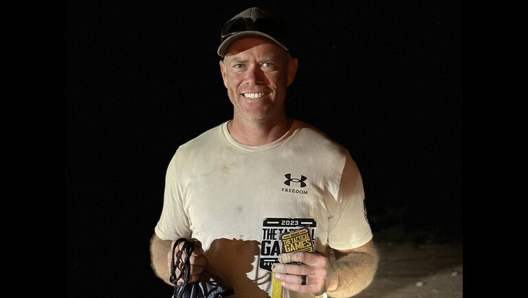 Jared with a Tactical Games trophy